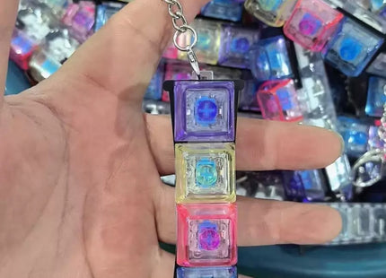 Μπρελόκ fidget πληκτρολόγιο 4 πλήκτρων στο χέρι