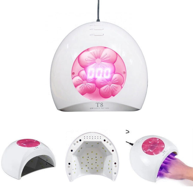 Λευκό φουρνάκι νυχιών T8 UV LED 65W με ροζ ανθισμένο διακοσμητικό, ψηφιακή οθόνη και εσωτερικές λυχνίες.